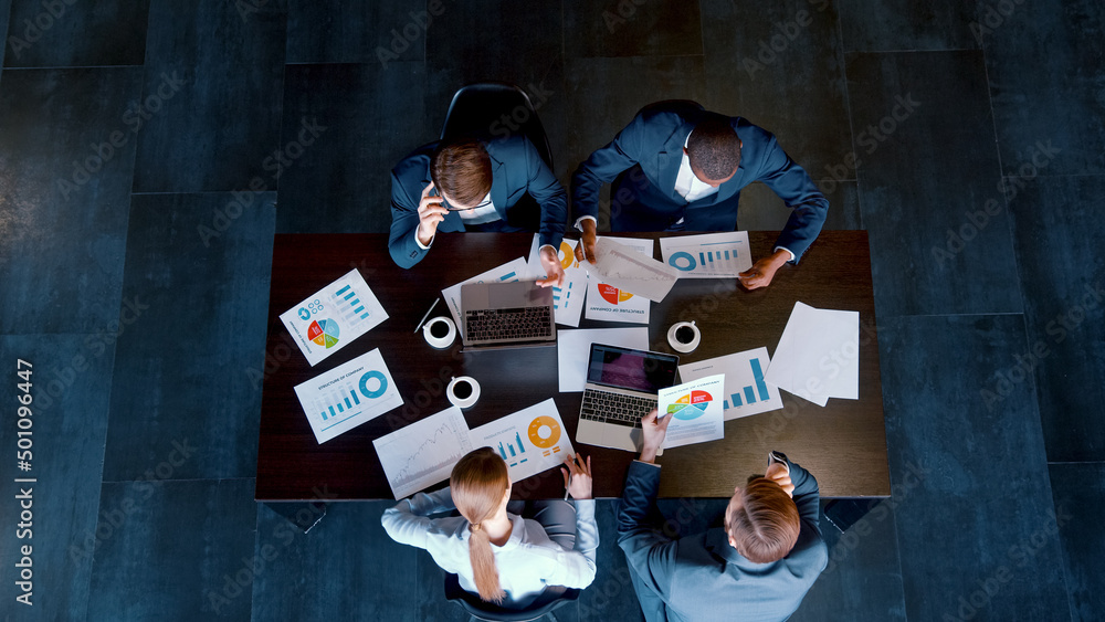 Business people in suits at a meeting in a modern office building