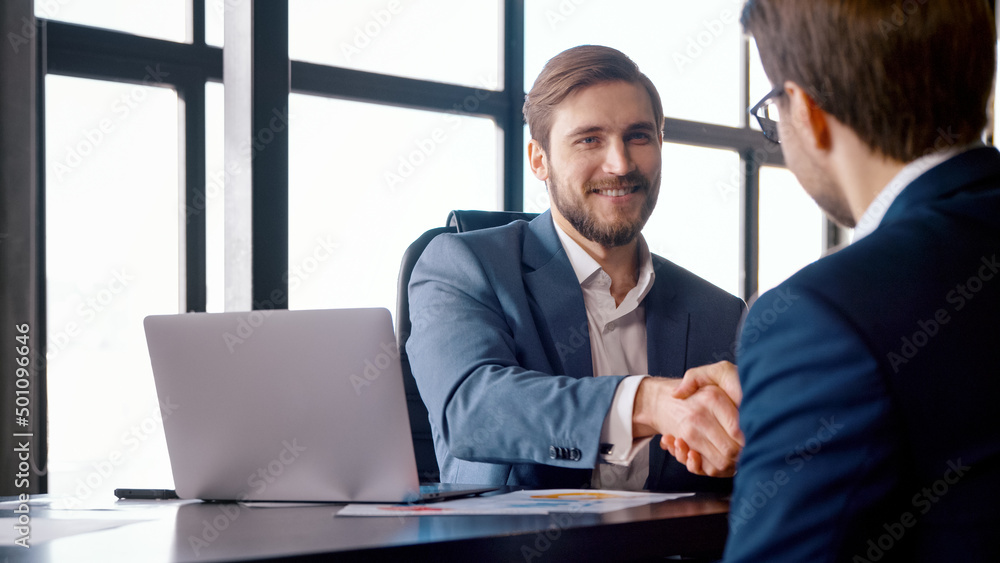 Handshake of boss and subordinate after successful job interview