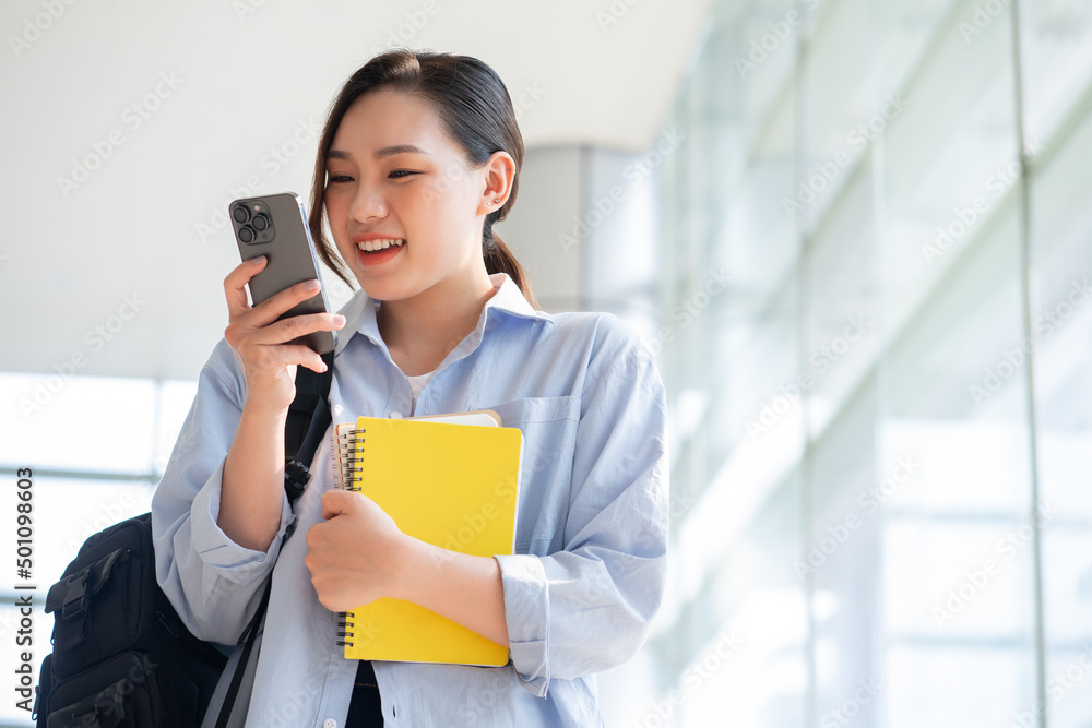 Image of young Asian college girl at school