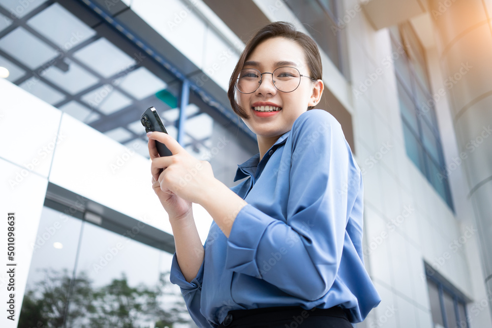 Image of young Asian businesswoman outside