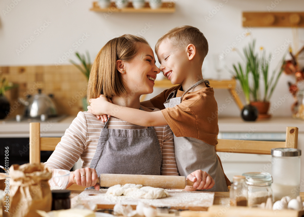 Positive family loving mother and son cooking together