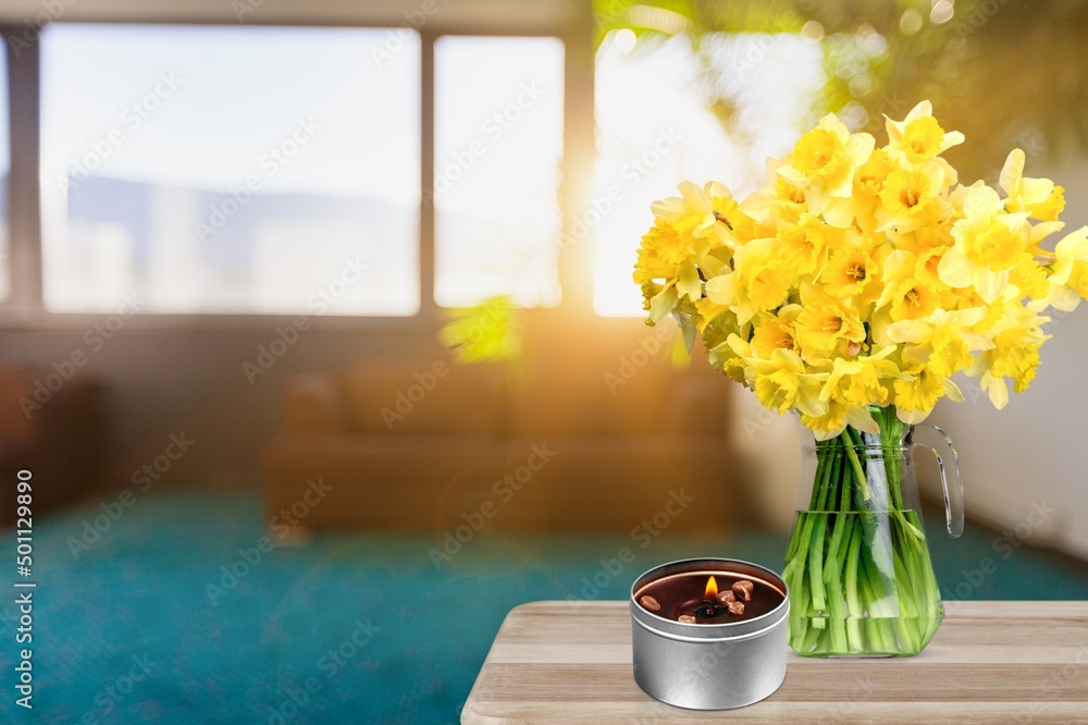 Yellow daffodils flower on the table. Yellow spring home decoration, fresh bouquet of flowers.