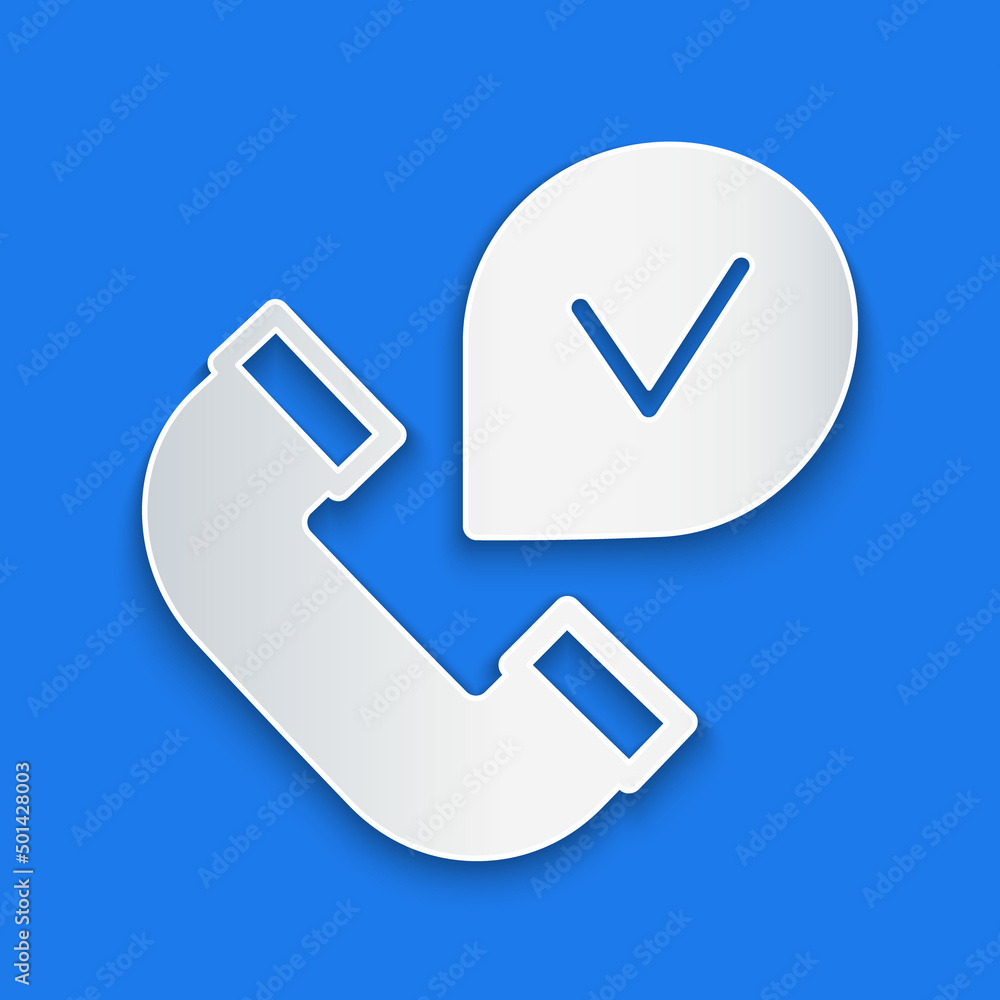 Paper cut Telephone handset icon isolated on blue background. Phone sign. Paper art style. Vector