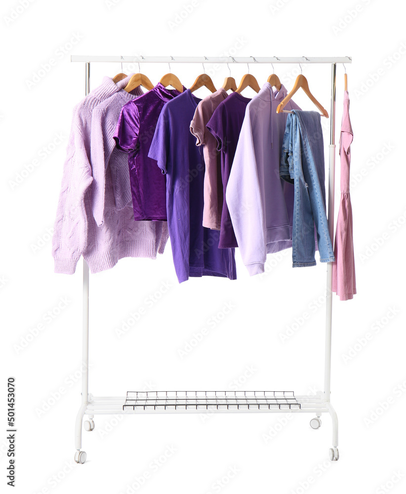 Rack with female clothes on white background