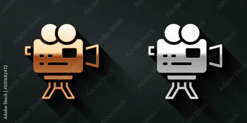 Gold and silver Retro cinema camera icon isolated on black background. Video camera. Movie sign. Fil