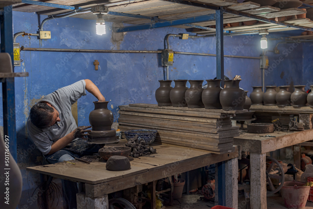 Workstation of a latin craftsman that produces talavera pottery