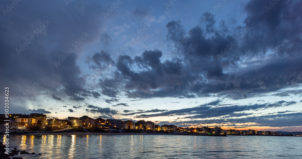 View of the reflection in the Black Sea against the background of the sky and sunset