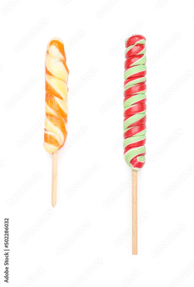 Delicious lollipops on white background