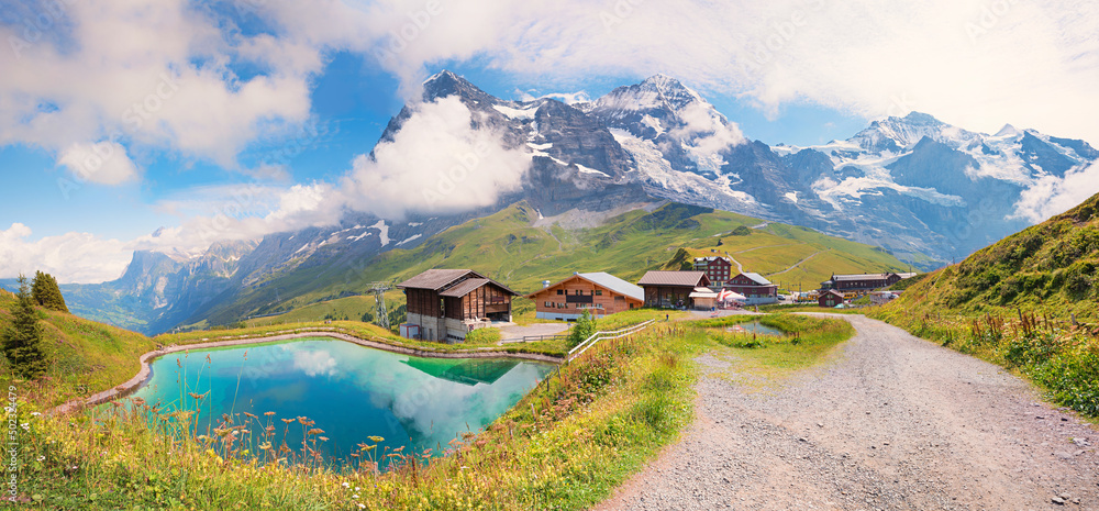 wonderful hiking route to Kleine Scheidegg, accumulation lake and mountain view, switzerland