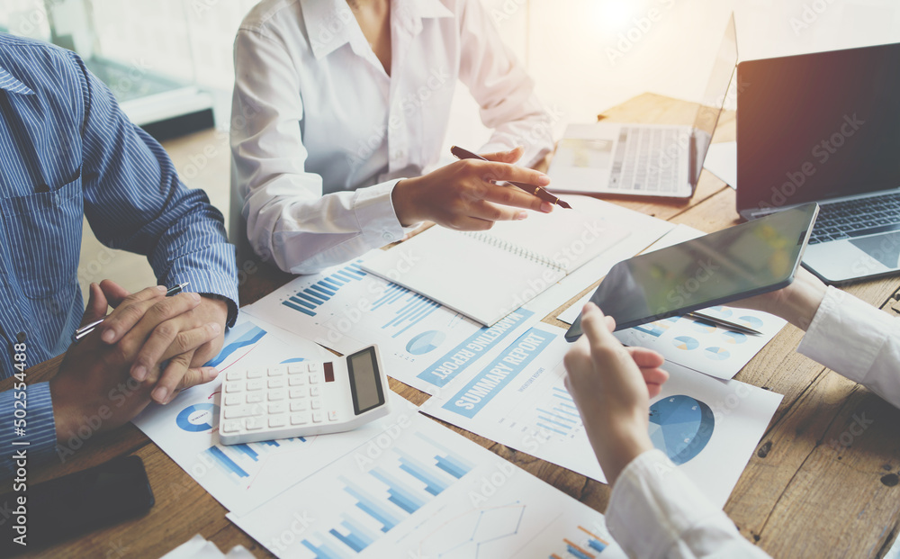 Business professionals working together at office desk, Financial adviser working with client, calcu