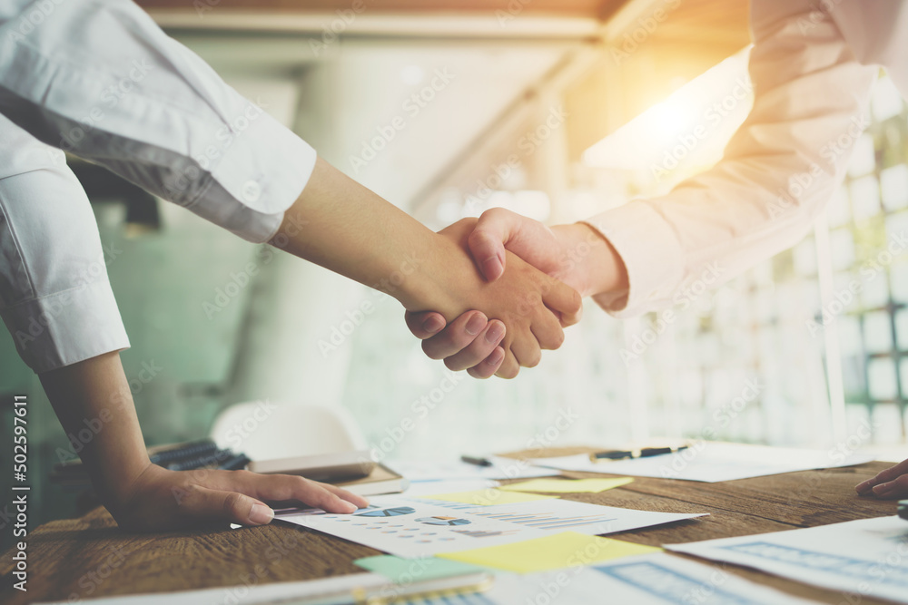 Entrepreneurs collaboration deal shaking hands in a modern office. Business people shaking hands  fi