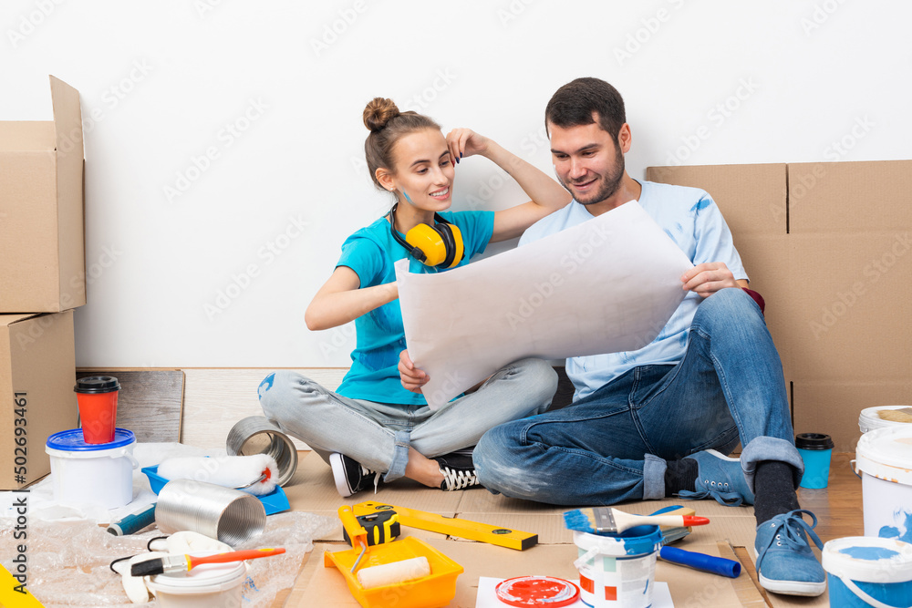 Young man and woman planning home renovation