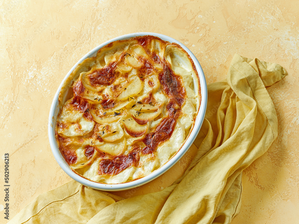 bowl of freshly baked potato gratin