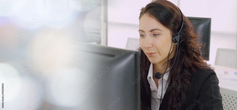 Business people wearing headset working in office to support remote customer or colleague. Call cent