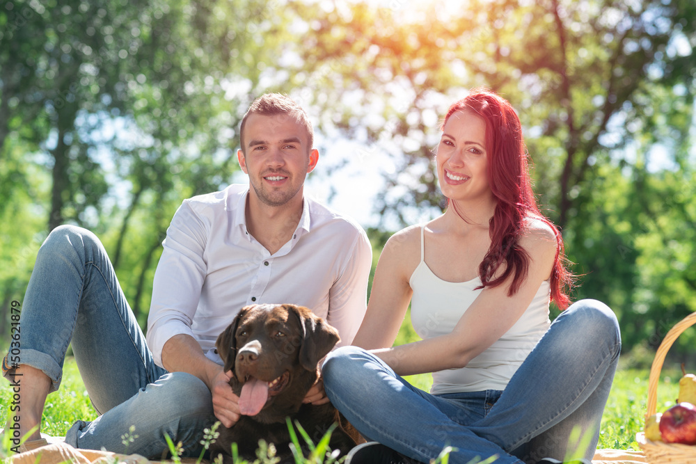 Couple with a dog in the park