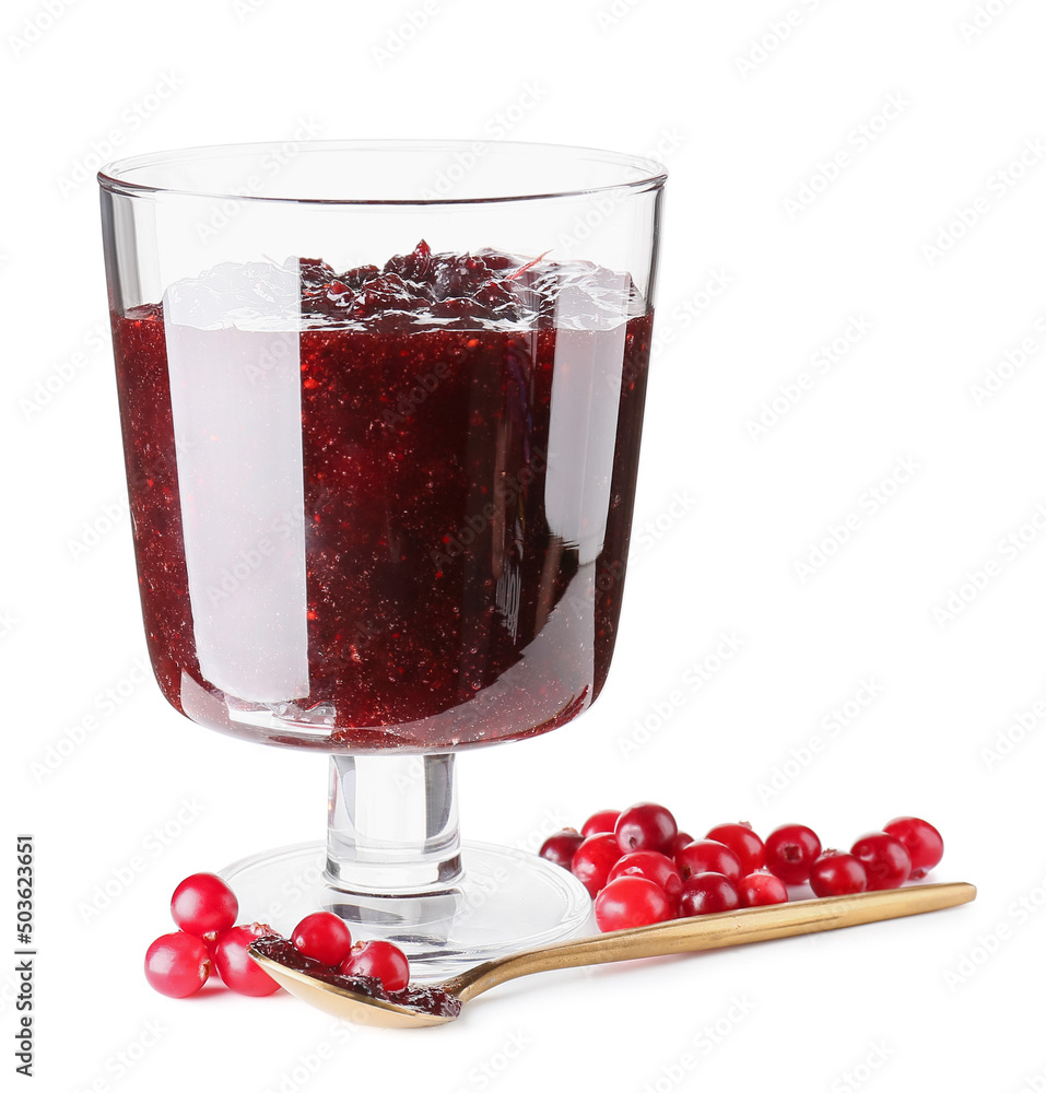 Glass bowl with tasty lingonberry jam and fresh berries on white background