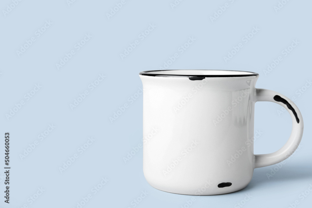 New ceramic cup on light background