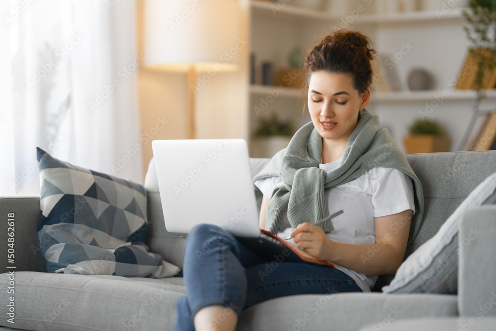 woman working on laptop at home