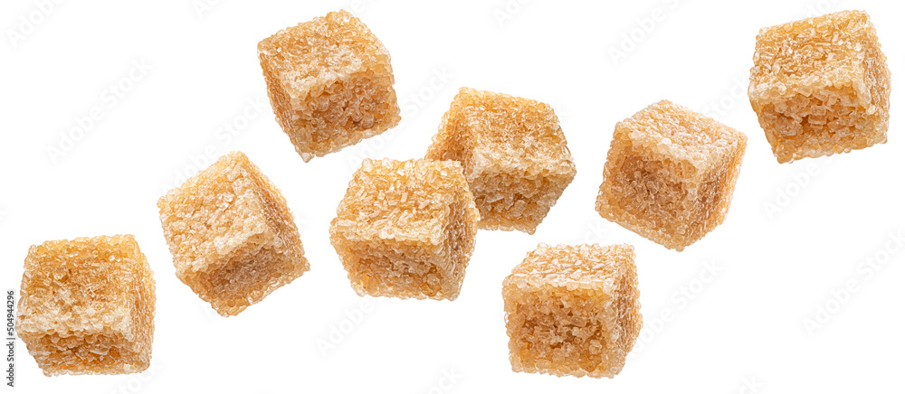 Falling cubes of cane sugar isolated on white background