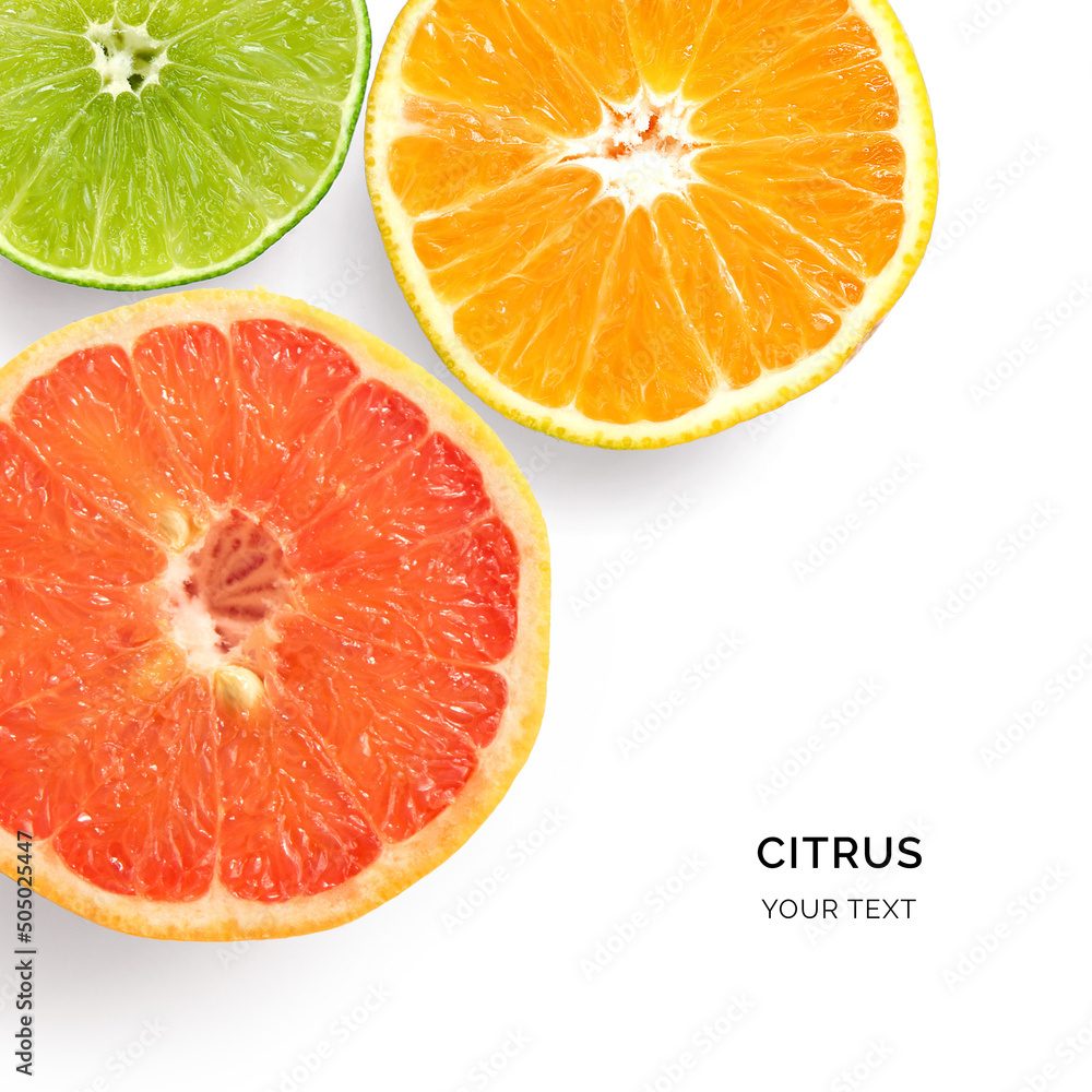 Creative layout made of grapefruit, lime and orange fruits. Flat lay. Food concept. Macro concept. 