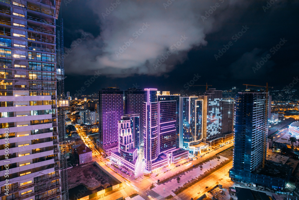 Street Night City Traffic and highrise houses . Elevated View Cityscape Skyline. Night Light Lightin