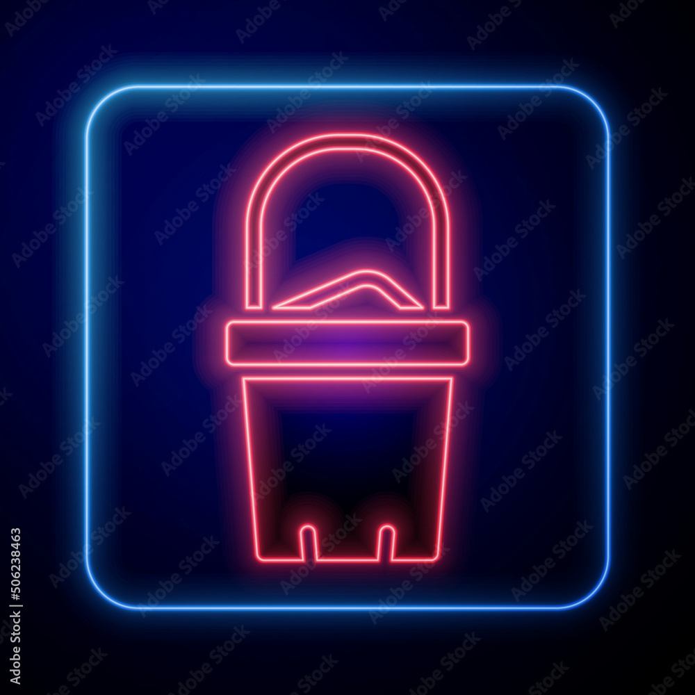 Glowing neon Sand in bucket icon isolated on black background. Plastic kid toy. Summer icon. Vector