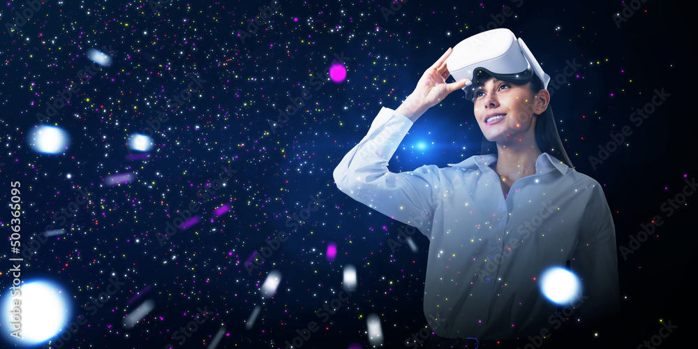 Abstract double exposure image of smiling young white european woman with VR glasses on starry sky s