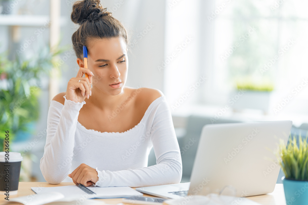 woman working on laptop at home