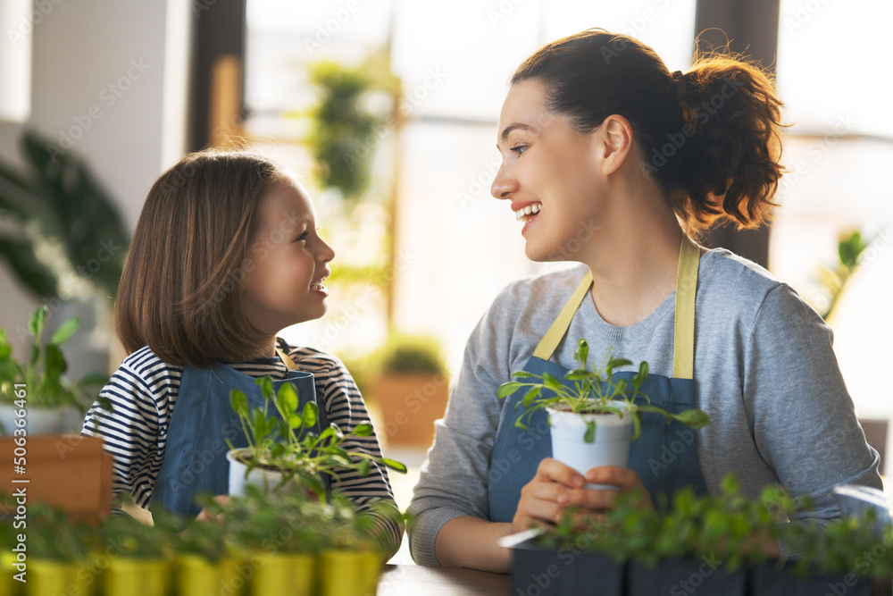 Family caring for plants