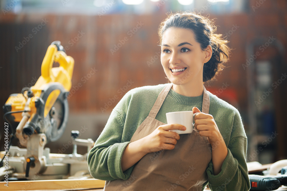 woman is training to be a carpenter