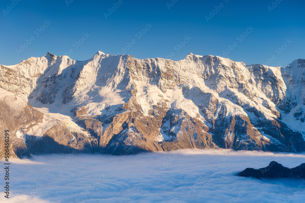 Mountain scenery in the Swiss Alps. Mountains peaks. Natural landscape. Mountain range and clear blu