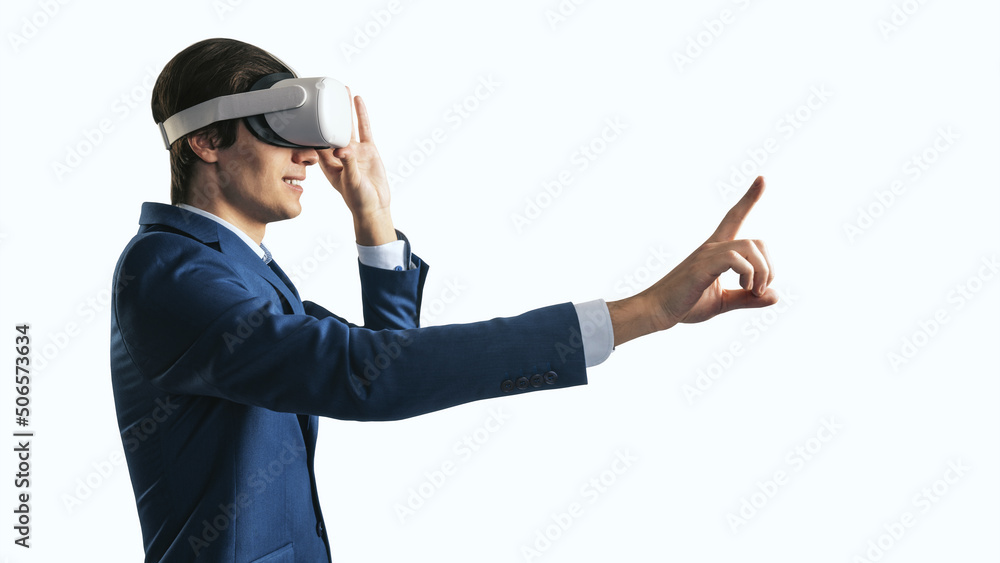 Young businessman working in virtual reality office in VR glasses, presses his finger virtual interf