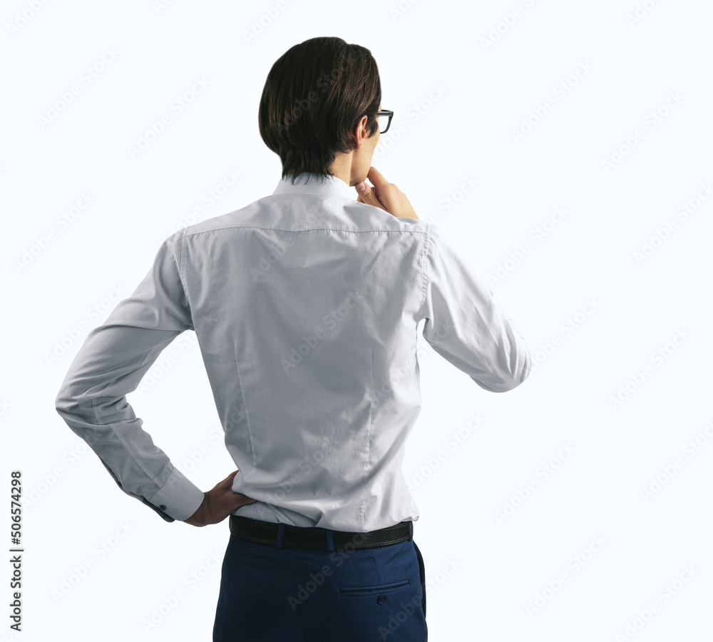 Thinking concept with pensive businessman in white shirt and glasses standing on abstract white wall