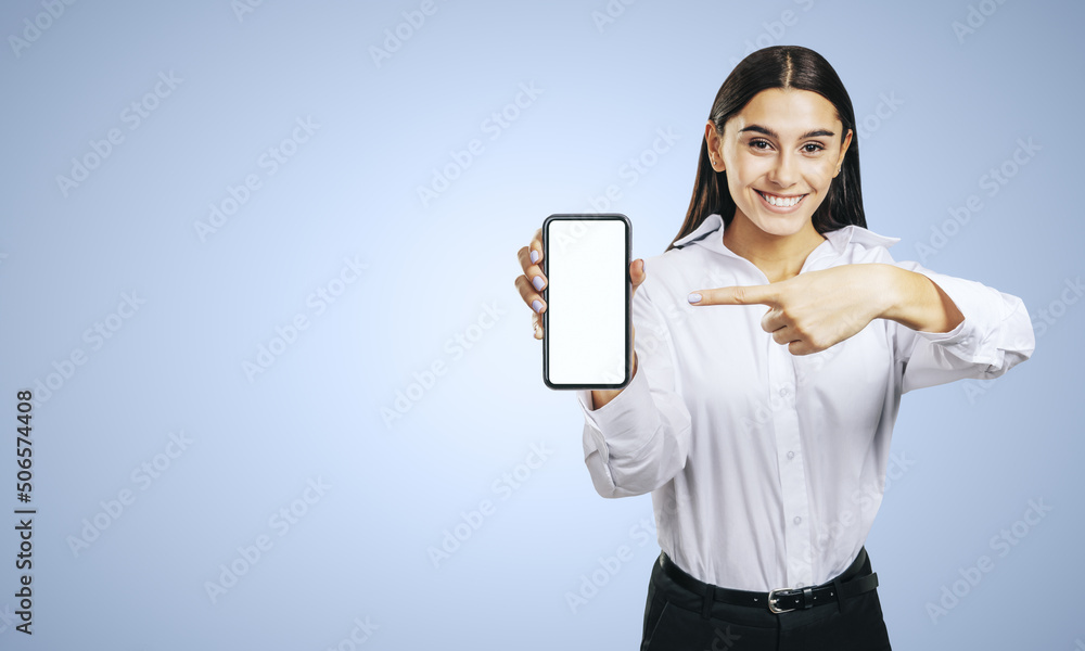 Mobile application concept with smiling businesswoman in white shirt showing modern cellphone with w