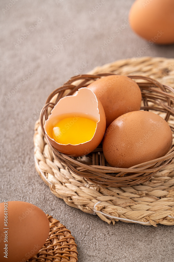 Fresh brown chicken eggs in a plate.