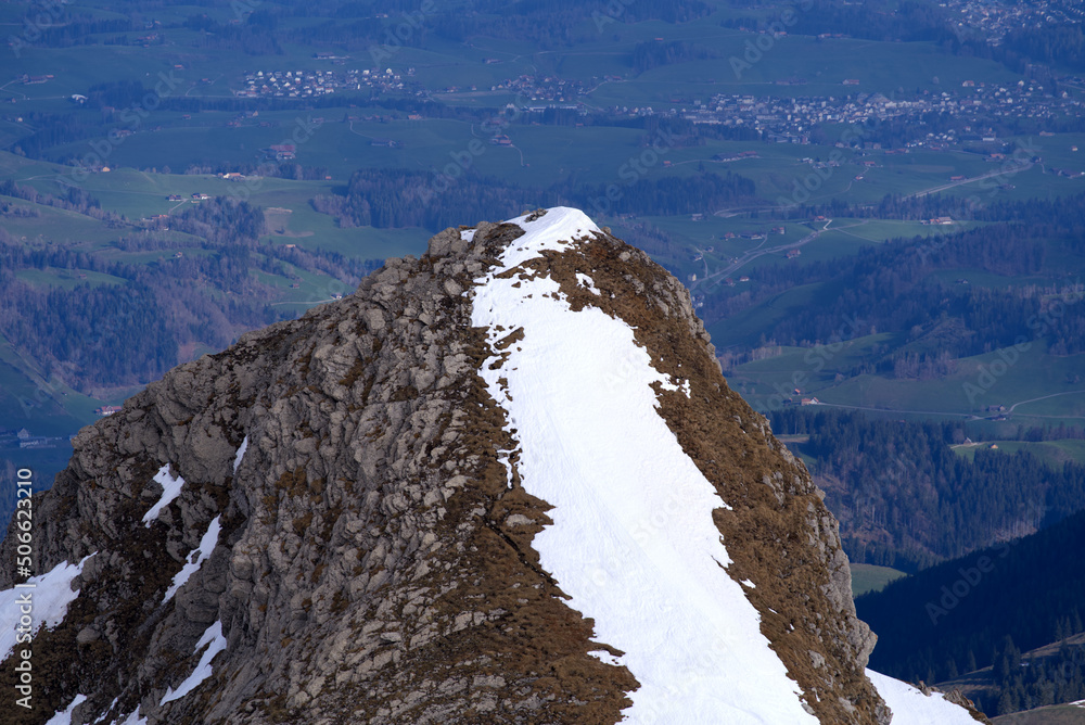 Aerial view over the Swiss Alps seen from Säntis peak at Alpstein Mountains on a sunny spring day. P