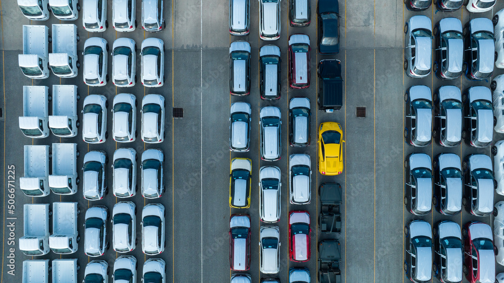 Aerial view a lot of new car for import and export shipping by ship; Smart dealership at car depot; 