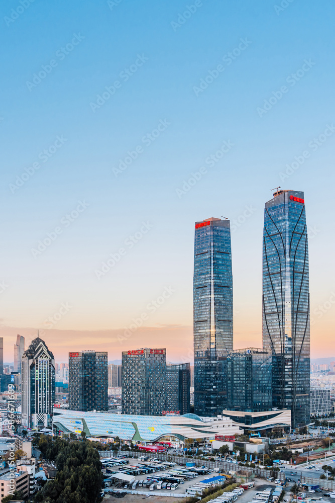 Dusk scenery of the twin towers and city skyline of Kunming, Yunnan, China