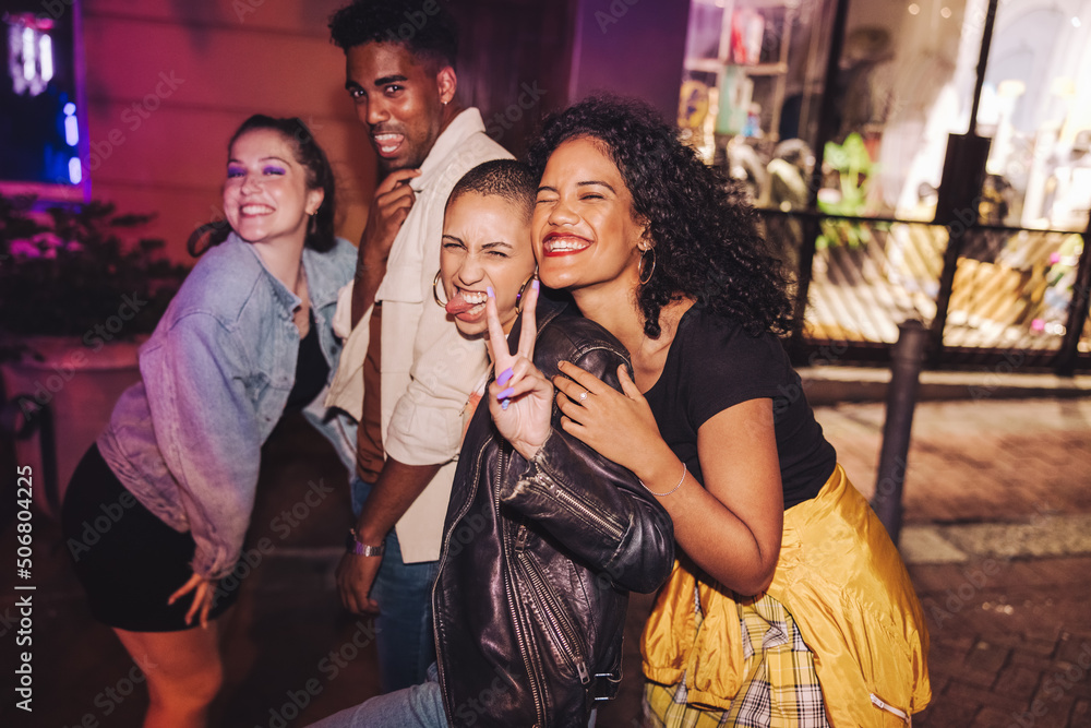 Group of vibrant friends having a good time outdoors