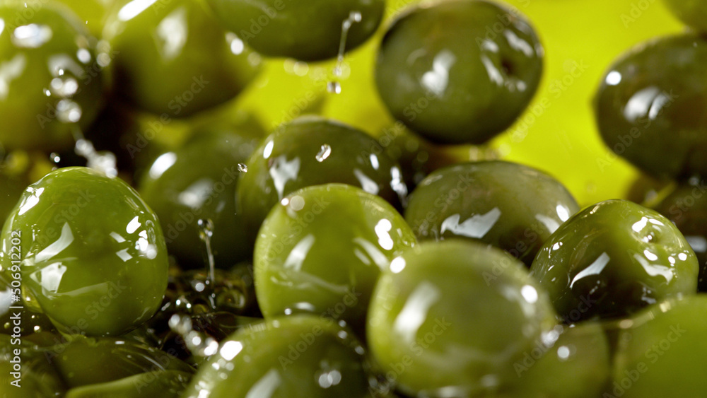 Close-up of green olives placed in oil.