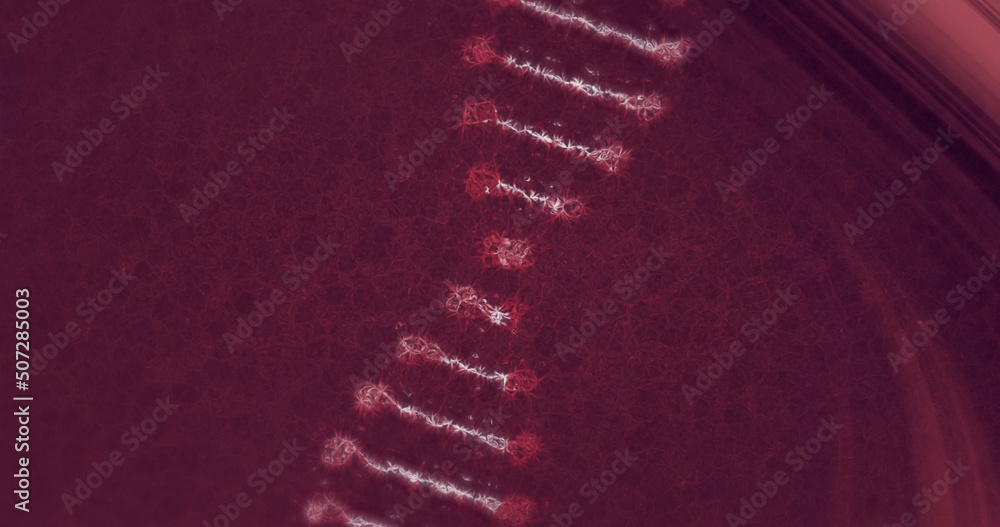 Image of dna strand spinning over dark red light trails