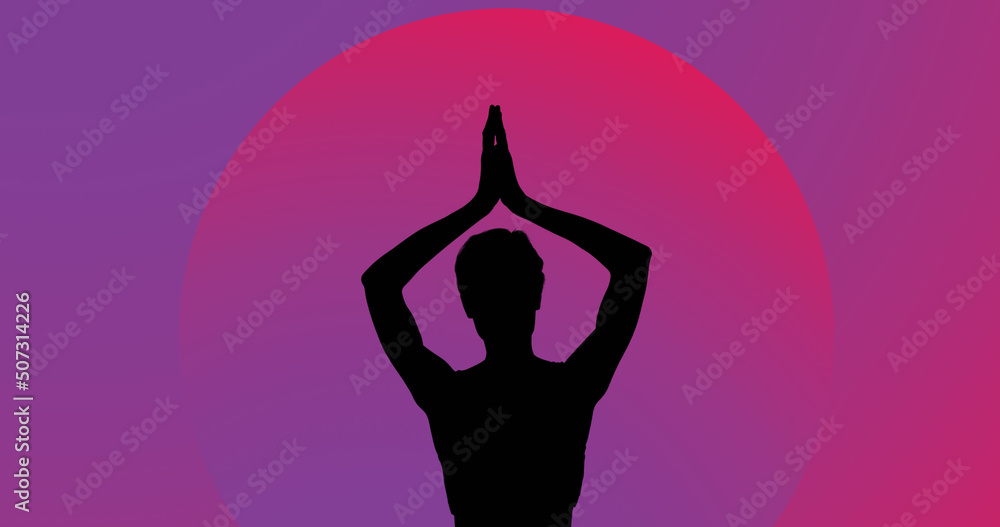 Image of woman meditating silhouette on purple background