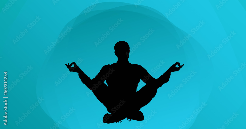 Image of man meditating silhouette on blue background