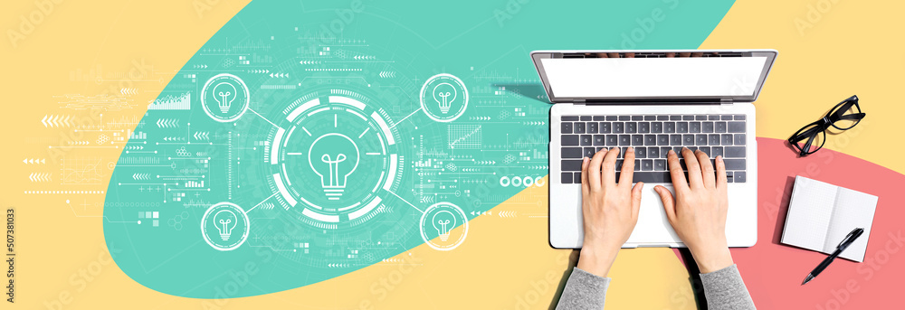 Idea light bulb theme with person using a laptop computer