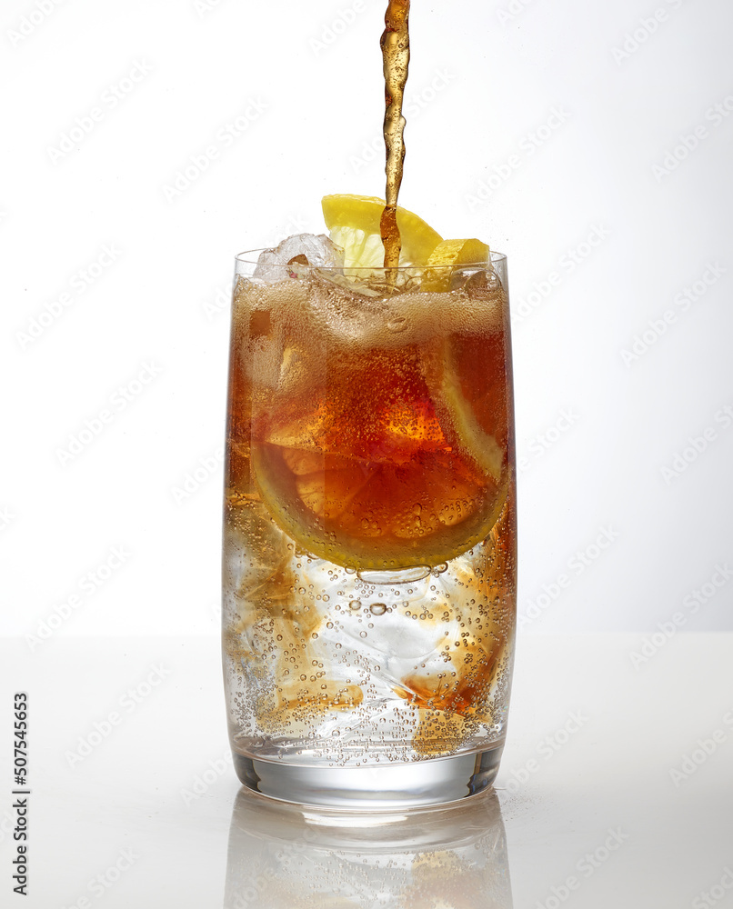 cola pouring into cocktail glass