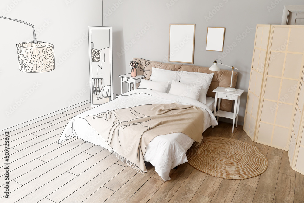 Interior of stylish bedroom with mirror and blank posters