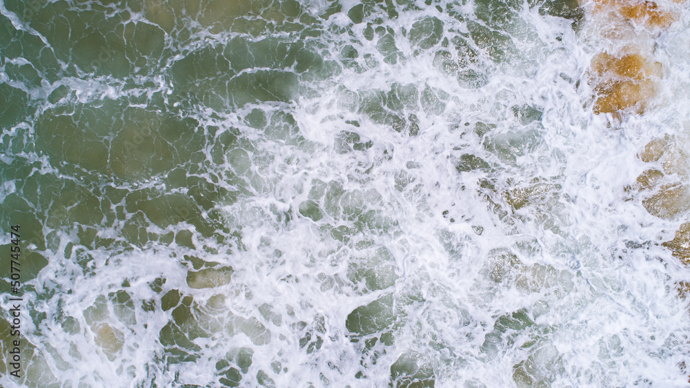 Top View of the Sea texture waves Foaming and Splashing in the Ocean Sunny day beautiful sea surface