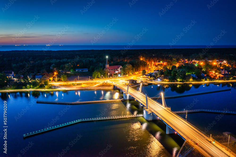 Drawbridge to Sobieszewo Island on the Martwa Wisla river at dusk. Poland