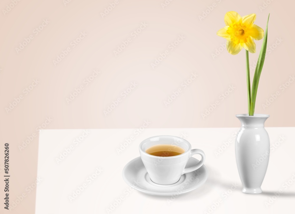 Flowers and tea cup served for breakfast, valentines day, wedding or anniversary morning decoration