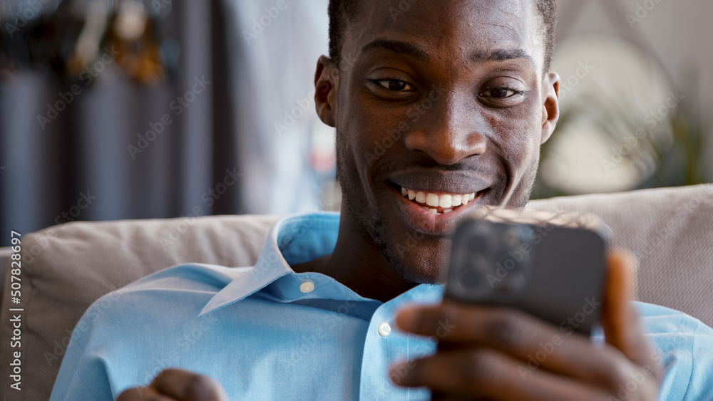 Happy man talking with friend using smartphone